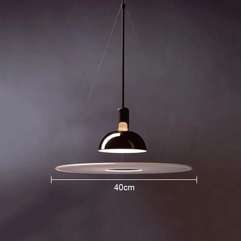Black dome-shaped pendant light with 40cm base in polished brass and white flying saucer chandelier by decorbites flying saucer