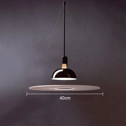 Black dome-shaped pendant light with 40cm base in polished brass and white flying saucer chandelier by decorbites flying saucer