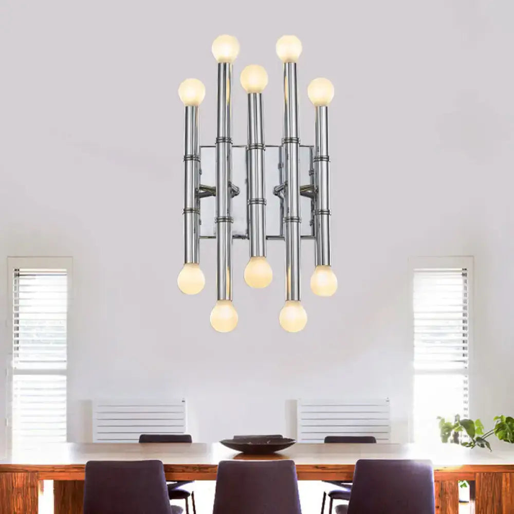 Modern polished gold metal tubes chandelier with nine glowing spherical bulbs in a symmetrical vertical cluster design