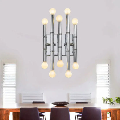 Modern polished gold metal tubes chandelier with nine glowing spherical bulbs in a symmetrical vertical cluster design