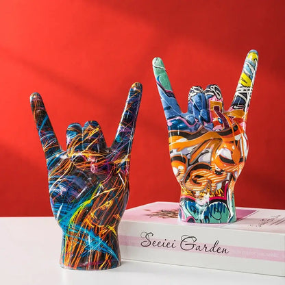 Modern pop art resin hand statue with vibrant neon graffiti patterns ideal for living room decor