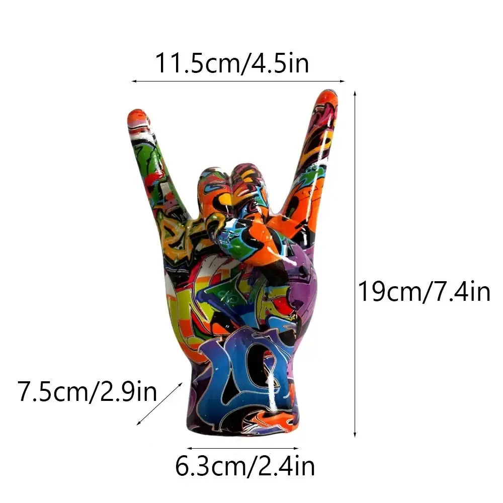 A vibrant glossy resin modern pop art hand statue in rock gesture with graffiti paint splatters for living room decor