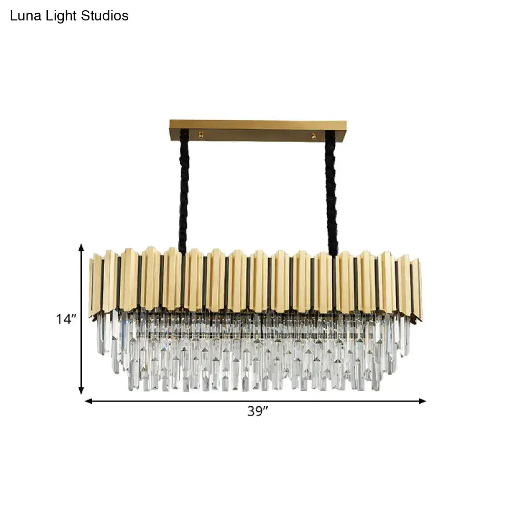 Gold-toned pendant light featuring vertical brass bars and cascading crystal prisms in a crystal prismatic gold finish