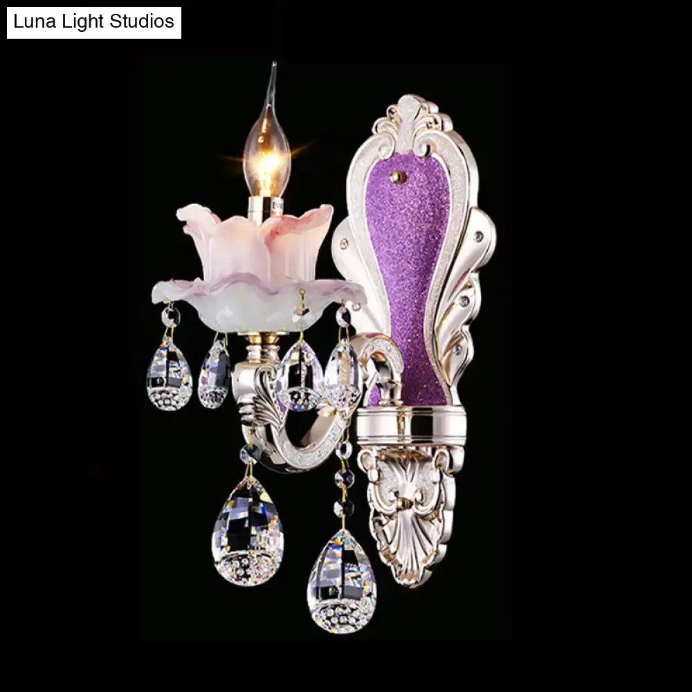 Elegant silver-toned modern wall sconce with pink floral glass shade, purple glitter panel, and crystal teardrop pendants