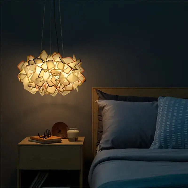 Modern purple and yellow petal led chandelier bedroom pendant light with warm-toned geometric paper-like petals by decorbites clizia led