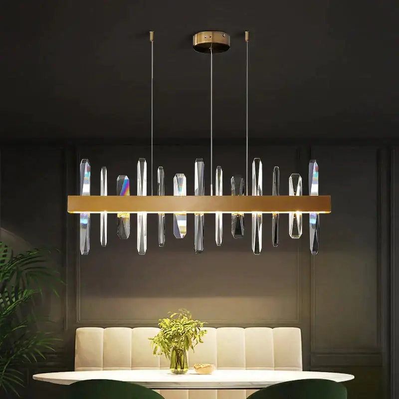 DecorBites™ Kyala modern rectangle gold crystal chandelier with clear prisms suspended from sleek metallic frame