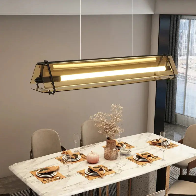 Modern gold-toned rectangular pendant lamp with sleek glass panels for dining room decorbites amber led pendant