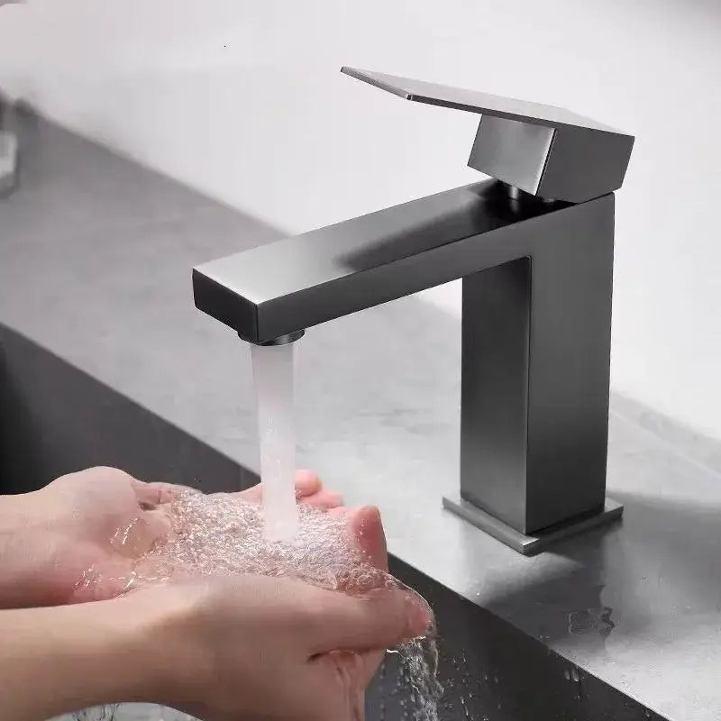 Modern matte black basin faucet with angular minimalist design complementing decorbites brushed gold bathroom mixer tap