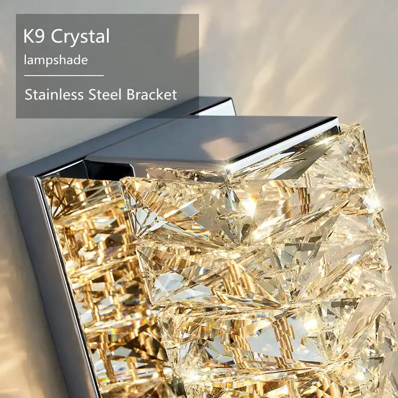 Modern rectangular crystal wall sconce with faceted clear k9 crystals and sleek stainless steel bracket for bedroom decorbites crystal wall