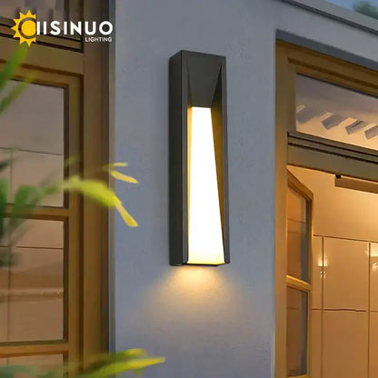 Modern rectangular led black outdoor wall lamp with sleek angular design and warm yellow light by decorbites led black