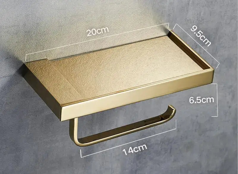 Modern rectangular gold-toned metal toilet paper holder with tray featuring a textured matte finish for bathroom use