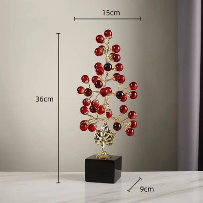 Modern red and gold grape vine metal sculpture with decorative glass berries on black pedestal for living room decorbites decor