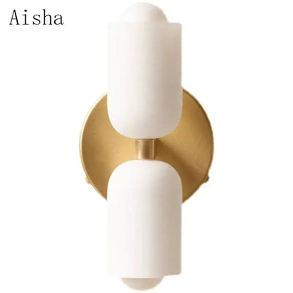 Aisha brand modern red and white double head glass wall light with matte white shades on gold-toned backplate for bedroom