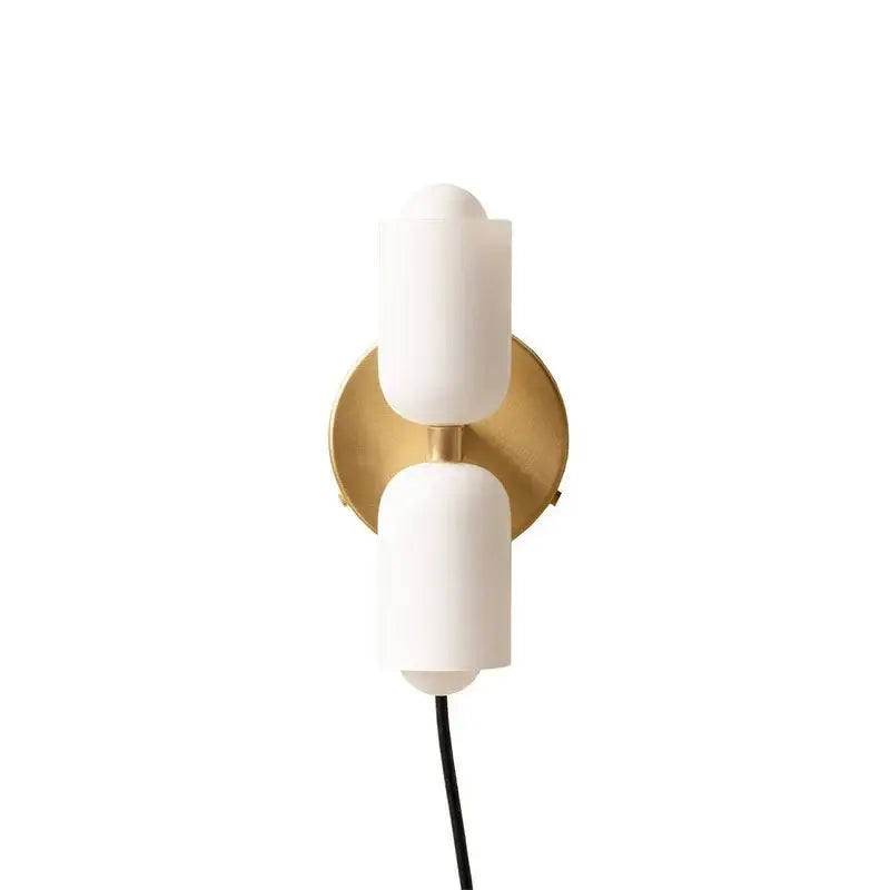Modern red and white double head glass wall light with matte glass shades and brass backplate for bedroom use
