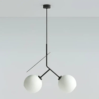 Modern black metal pendant light with two frosted white spheres complementing decorbites cherry led pendant light