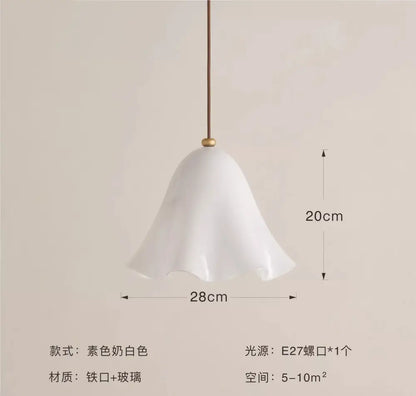 A delicate white glass pendant light with a fluted bell-shaped shade and brass suspension for modern interiors