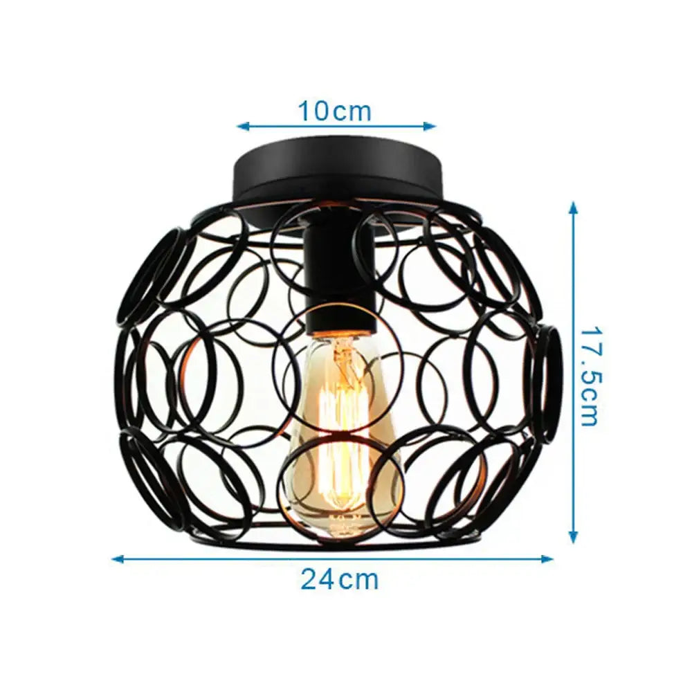 Modern retro black iron cage ceiling light with interlocking rings and visible edison bulb for kitchen lighting decorbites iron cage