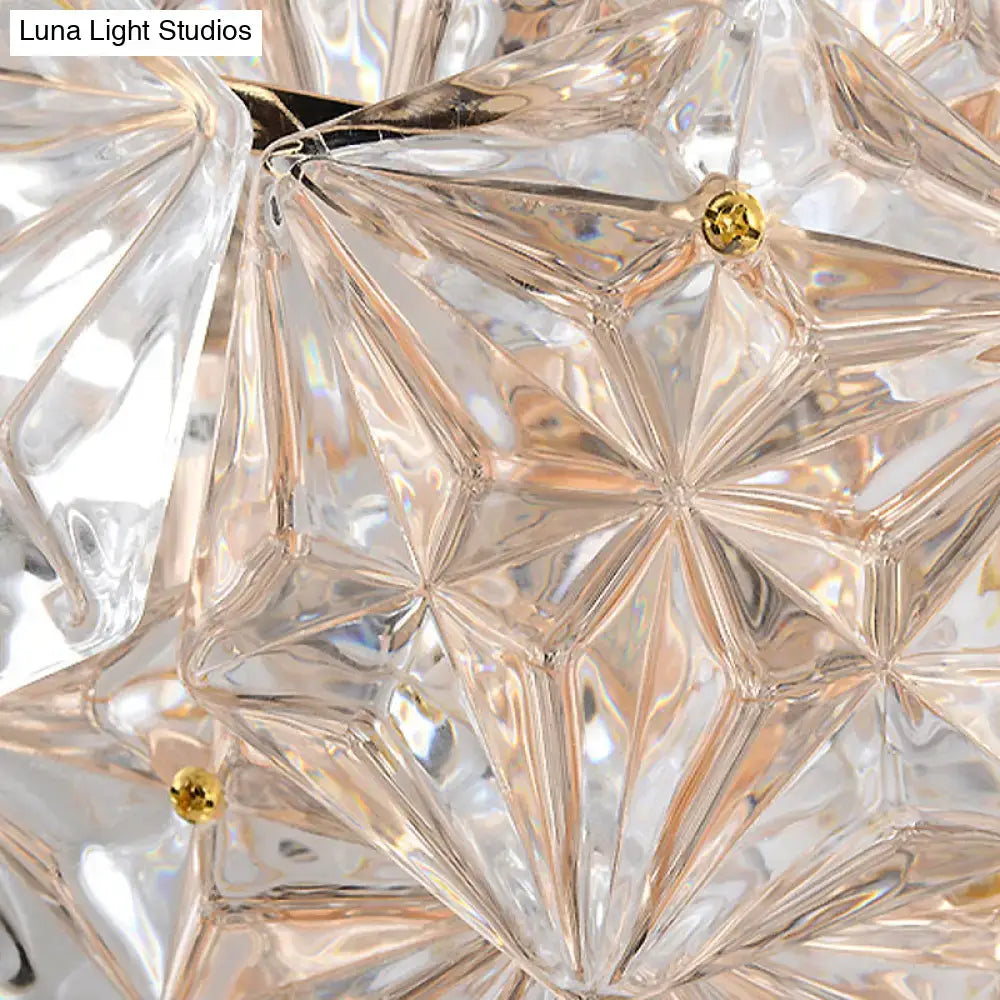 Modern rhombus clear crystal wall sconce featuring faceted crystal components and gold-toned accents for direct wired electric use