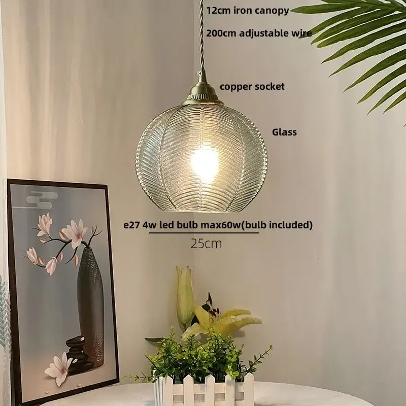 Modern ribbed blue glass led pendant lamp with textured spherical design and brass fittings for dining room lighting decorbites blue glass