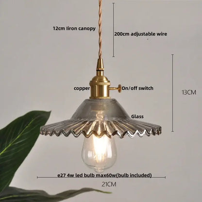 Modern ribbed clear glass led pendant light with a brass-finished copper base and adjustable 200cm wire suspension decorbites clear glass