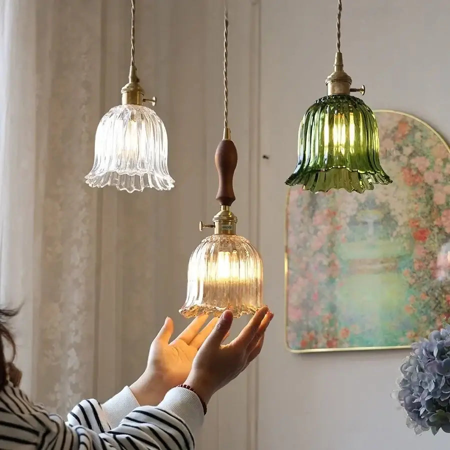 Three vintage-style pendant lights with fluted clear glass led shades and brass hardware for modern kitchen decorbites