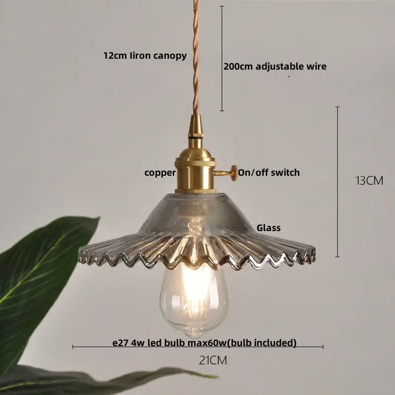 Modern ribbed clear glass led pendant light with brass-finished copper base and scalloped edge decorbites clear glass shade
