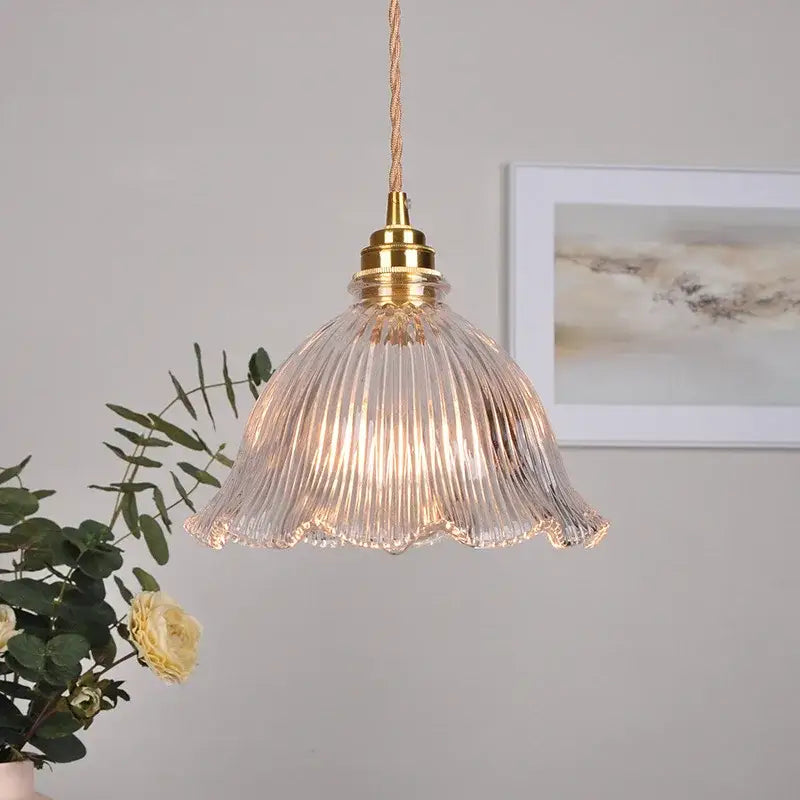 Modern ribbed clear glass pendant light with gold-toned brass fixture and twisted cord for kitchen decorbites clear glass