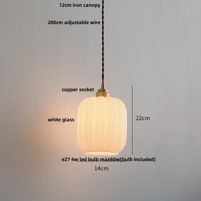 A modern pendant lamp with a ribbed white glass shade and decorbites copper white brass socket for living room decor