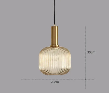A modern light chandelier with a gold metal stem and ribbed translucent glass colorful led pendants for dining rooms