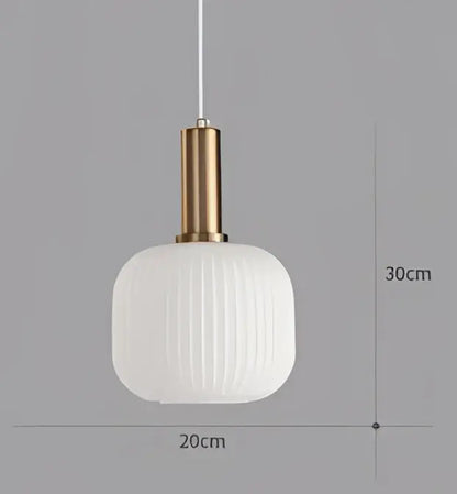 A modern white ribbed glass colorful led pendant light chandelier with a gold-toned metal fixture for dining room
