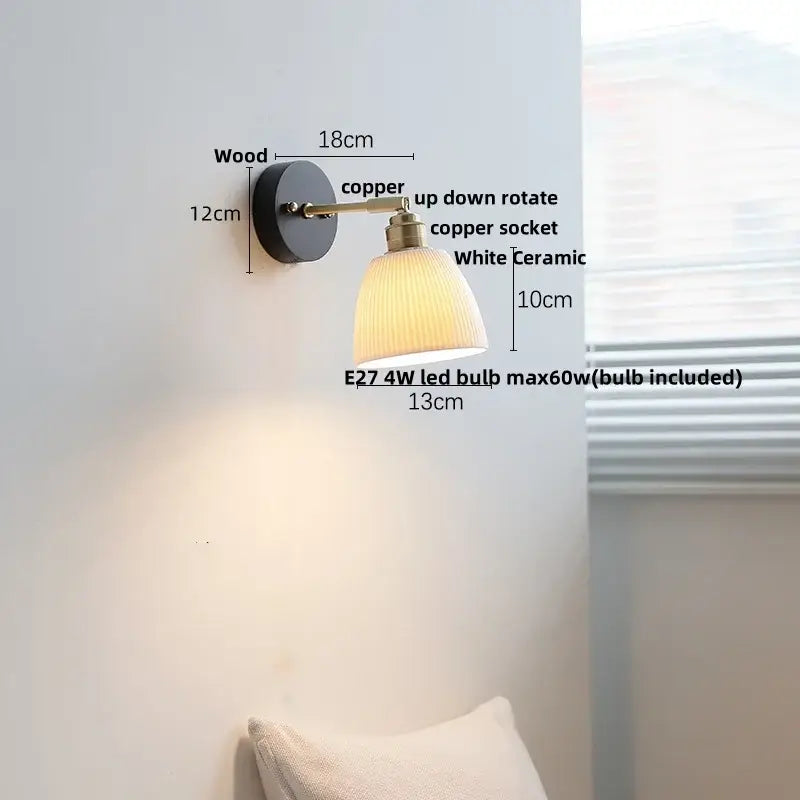 A vintage-style wall lamp with a black wooden base, copper led arm, and white ceramic shade for decorbites copper led wall