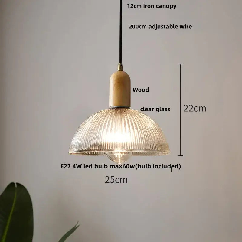 A warm-toned modern ribbed glass led pendant light with wood collar and iron canopy for kitchen chandelier use