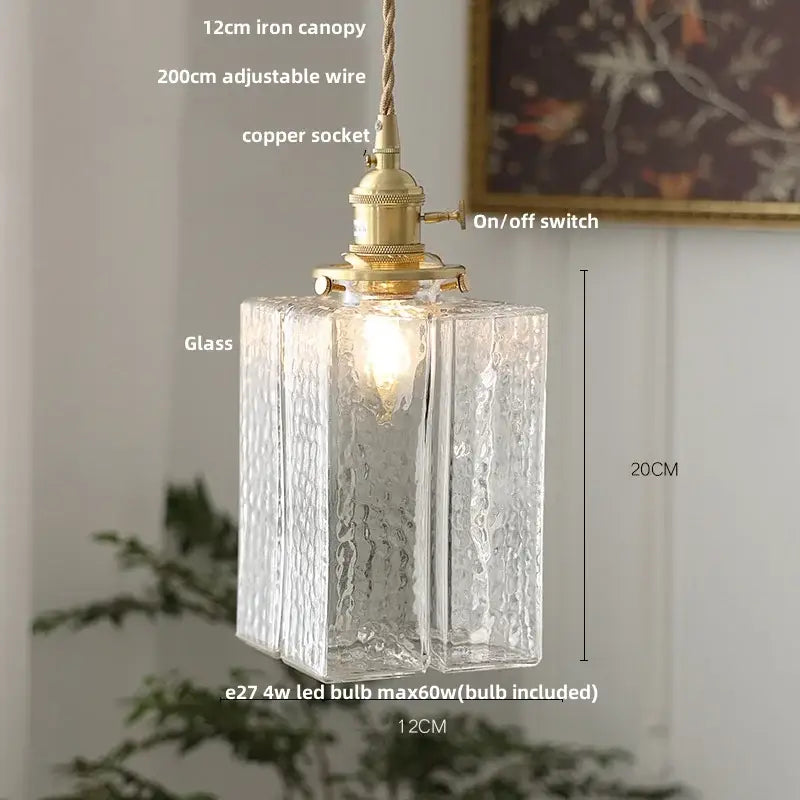 Modern ribbed glass led pendant light with clear textured glass, brass fixture, and adjustable copper socket for kitchen use