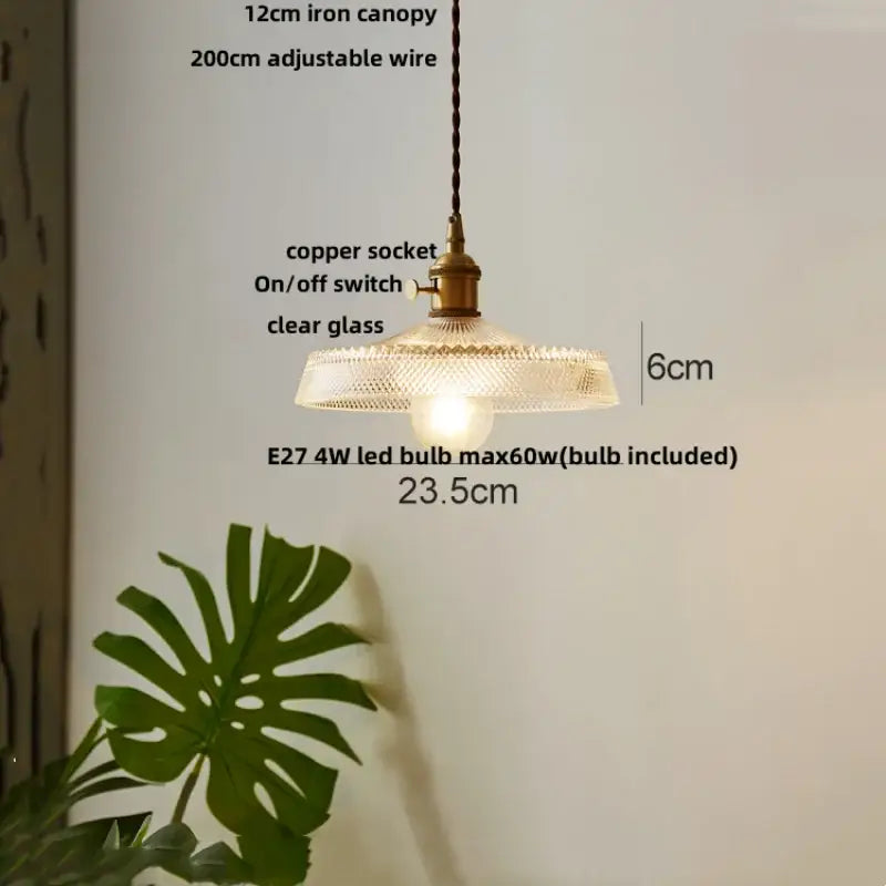 Vintage-style glass led pendant light with textured clear shade and antique brass socket for modern kitchen chandelier