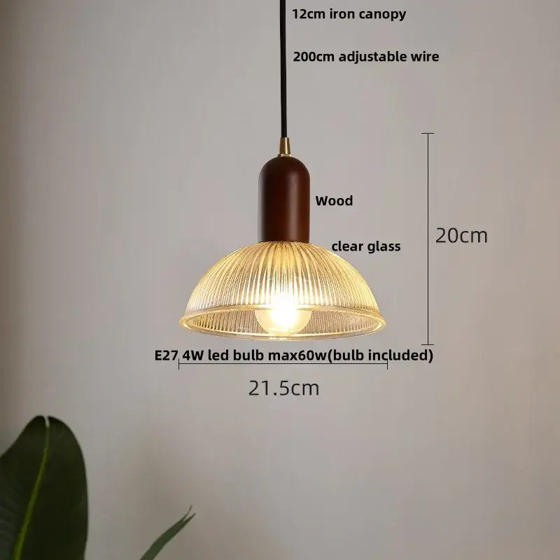 Modern ribbed glass led pendant light with warm-toned ribbed shade, dark wood column, and iron canopy for kitchen use