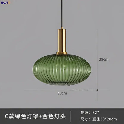 Modern ribbed glass pendant lights with green glass pendant and gold-toned brass stem for dining room lighting