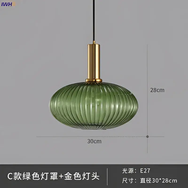 Modern ribbed glass pendant lights with green glass pendant and gold-toned brass stem for dining room lighting