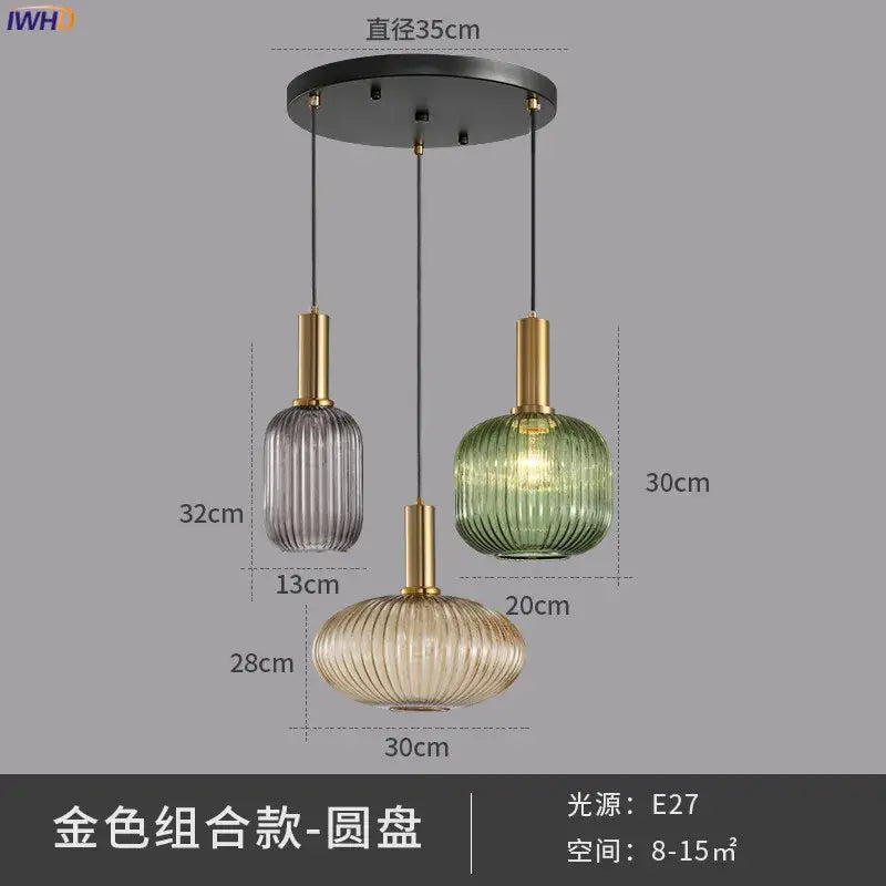 Set of three modern glass pendant lights with ribbed shades in gray green amber and brass stems for dining room