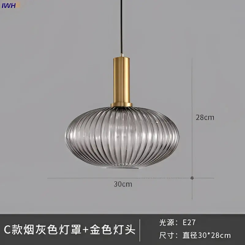 Modern ribbed gray glass pendant lights with gold-toned brass stem for dining room featuring sleek design