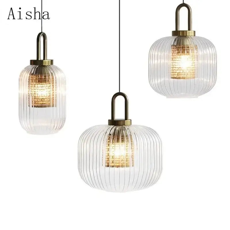 Modern ridged clear glass pendant lamp with brass accents and warm interior lighting for bedroom decorbites clear glass