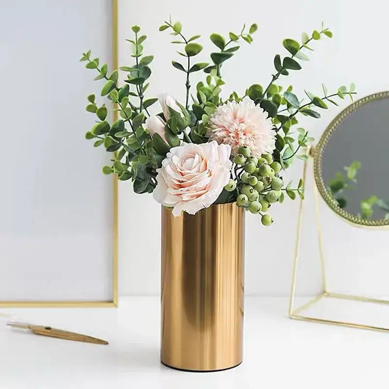 Modern ridged decorbites gold plated cylinder vase holding pink roses and greenery for living room decor
