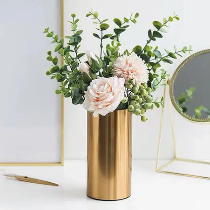 Modern ridged decorbites gold plated cylinder vase holding pink roses and greenery for living room decor
