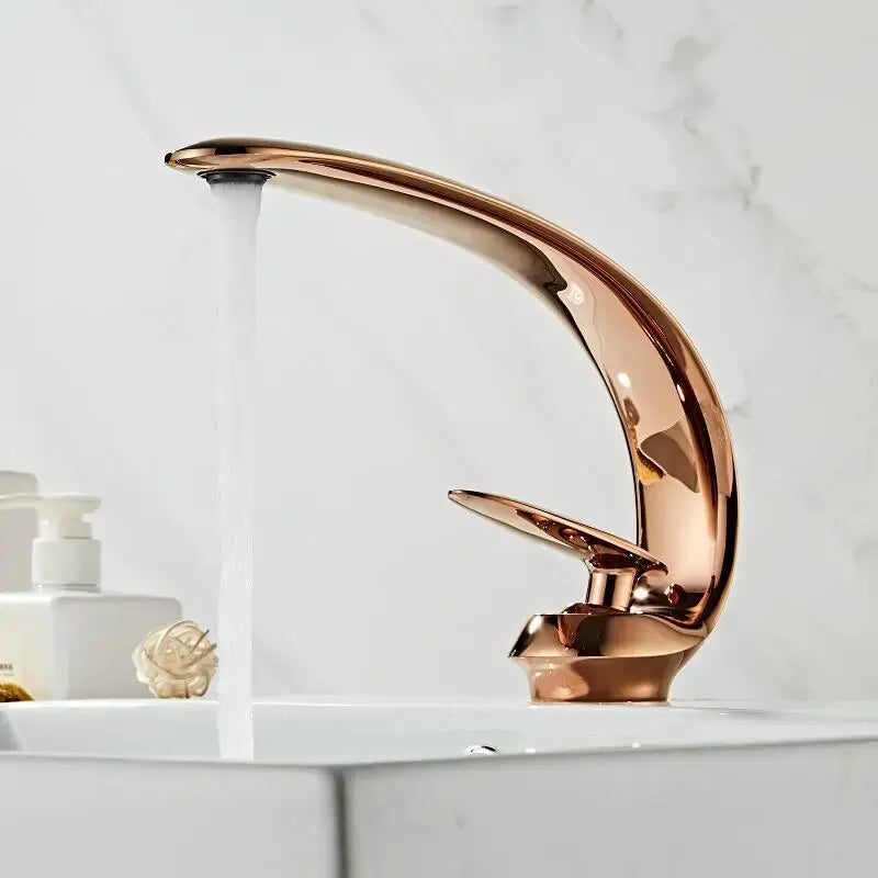 A modern rose gold and black brass basin faucet with a curved design for decorbites basin faucet bathroom use