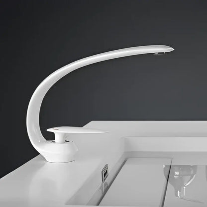 Modern rose gold and black brass decorbites basin faucet with sleek curved white ceramic design and integrated led lighting