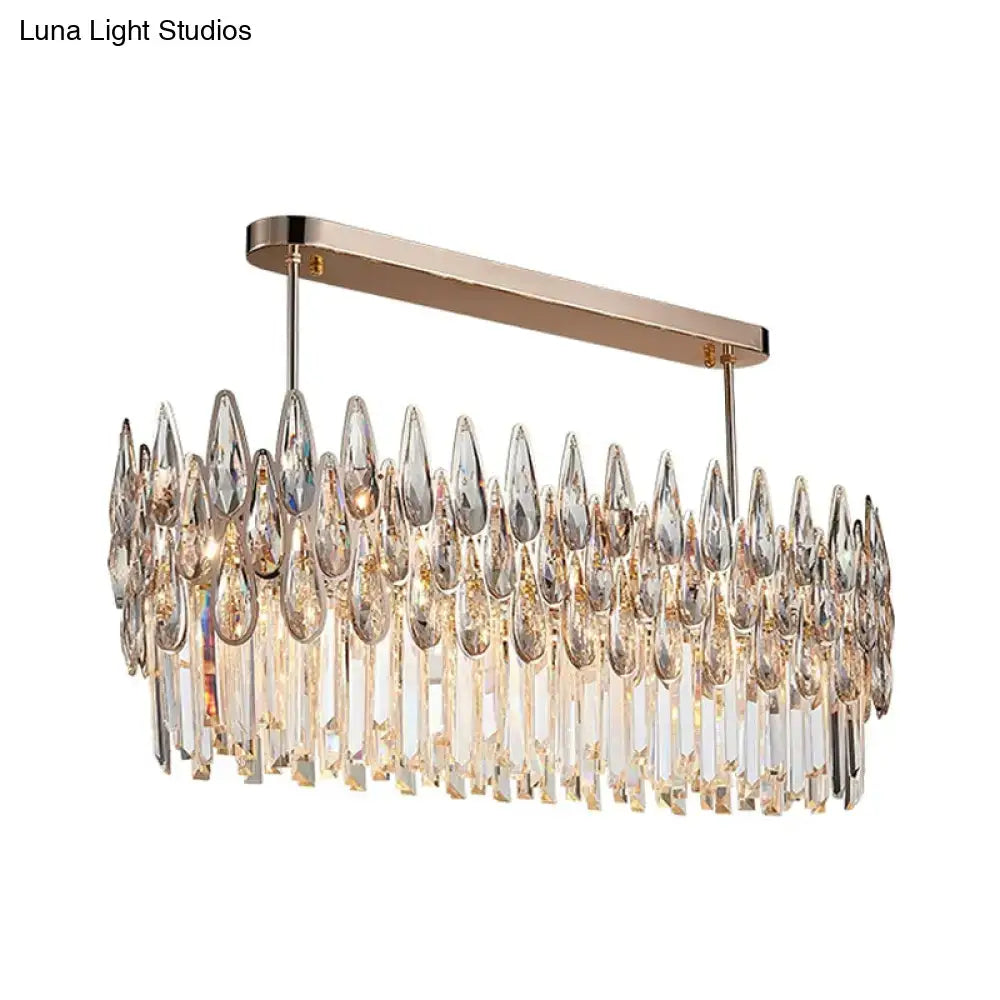 Elegant rose gold crystal island lamp with oval clear pendant featuring cascading crystal teardrops and glass rods