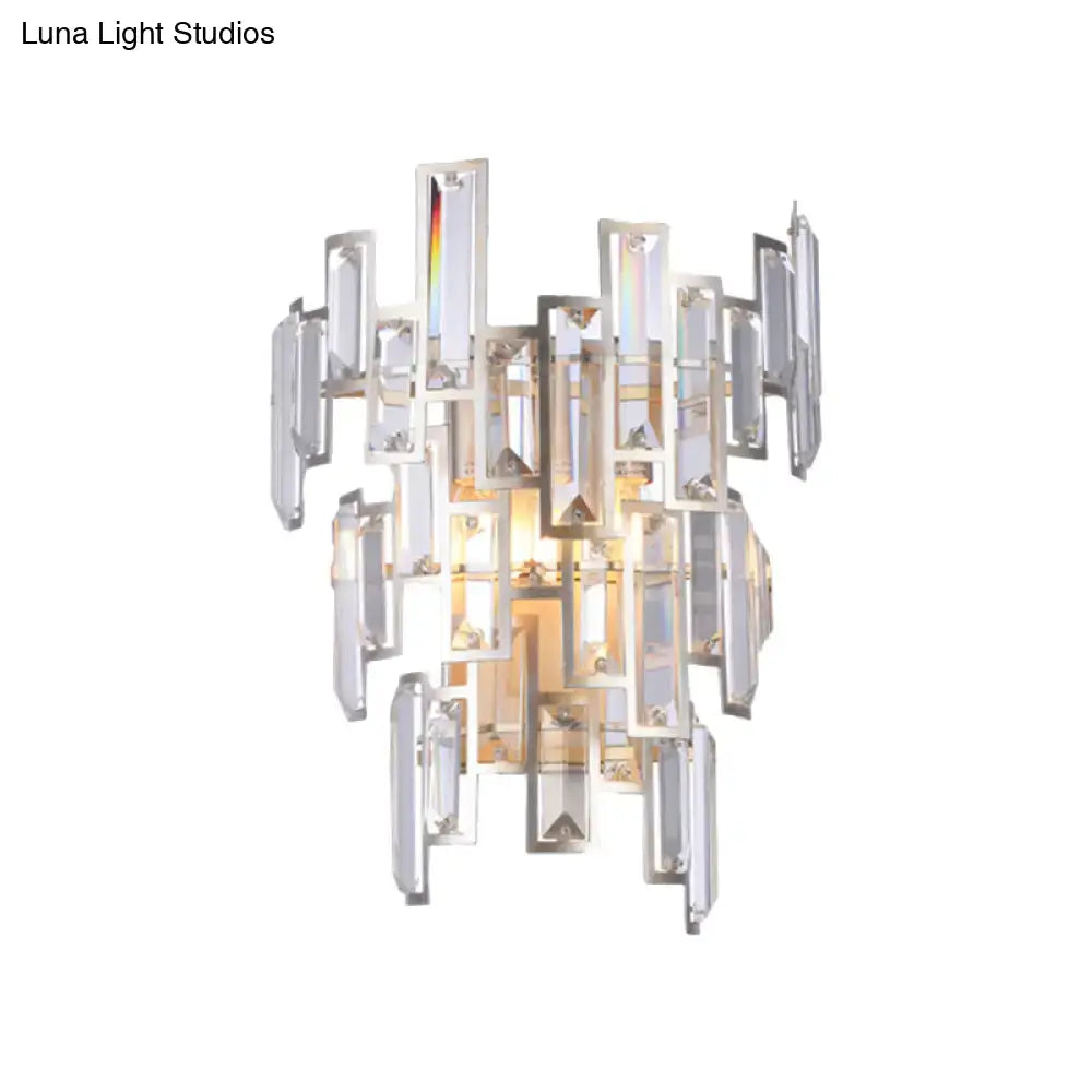 Modern rose gold wall lamp with clear crystal bars and polished chrome accents for dining room lighting