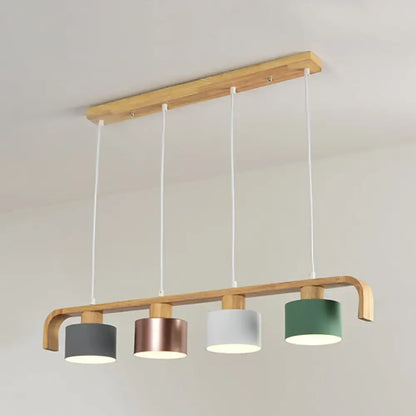 Modern rose gold drum island chandelier with natural wood frame and four gray rose gold white and green shades
