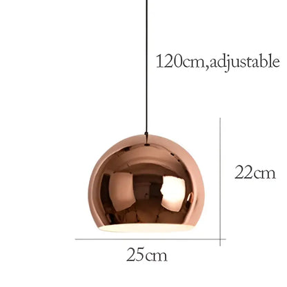 A sleek rose gold pendant light with a polished metallic dome design for dining room island decor by decorbites rose gold