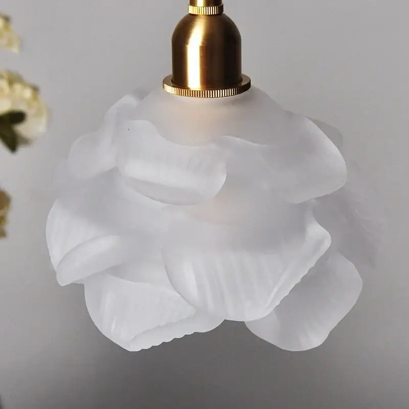 Delicate white frosted glass led pendant light with brass finish shaped like a rose for modern kitchen use