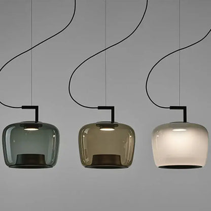 Modern sage green glass pendant lamp set of 3 with curved black cords and muted green amber frosted white shades for dining room